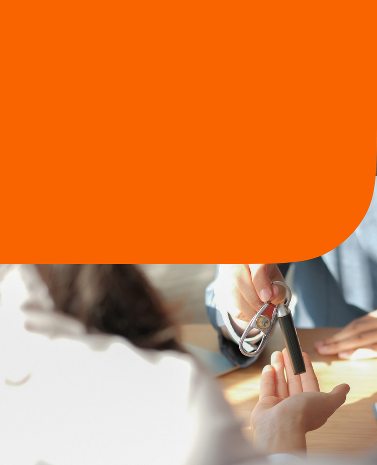 A person handing over car keys